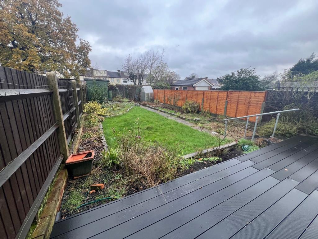 Lot: 118 - EXTENDED SEMI-DETACHED HOUSE FOR IMPROVEMENT AND REPAIR - Decking leading to laid lawn with path to rear garden